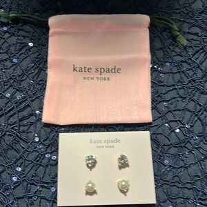 This is a pair of Kate Spade earrings, diamonds, and pearl. Not real